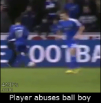 Soccer footballer kicks ball boy #1